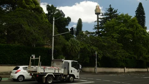 Traffic at lights with Sydney Observation Tower in the distance 6K Video stock 299878211