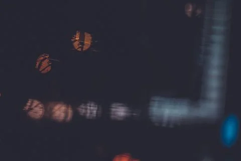 Traffic lights through the window in a rainy night Stock Photos