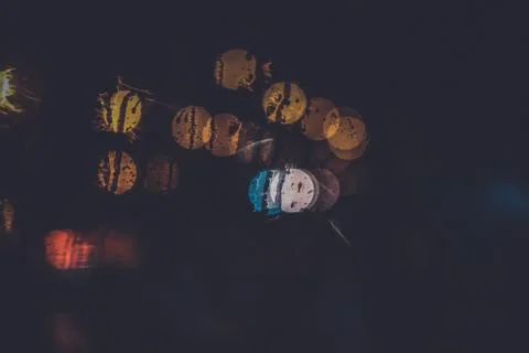 Traffic lights through the window in a rainy night Stock Photos