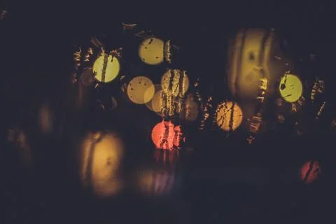 Traffic lights through the window in a rainy night Stock Photos