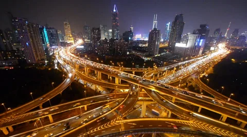 Traffic lights trail on overpass bridge at night,modern building. Vídeos de archivo 33824466