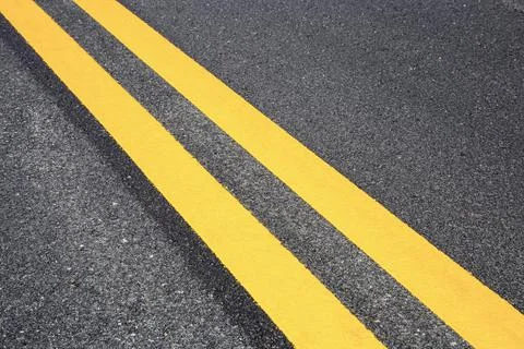 Traffic line on road with texture. Stock Photos