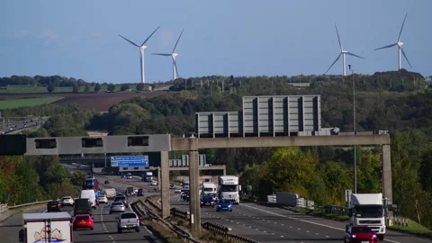 Traffic on M1 motorway passing hook moor windfarm leeds uk Video stock 163531230