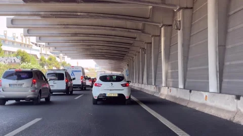 Traffic on Madrid M-40 passing beneath an overpass structure Vídeos de archivo 339026432