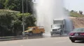 Traffic Moves Past Sheared Fire Hydrant HD Footage