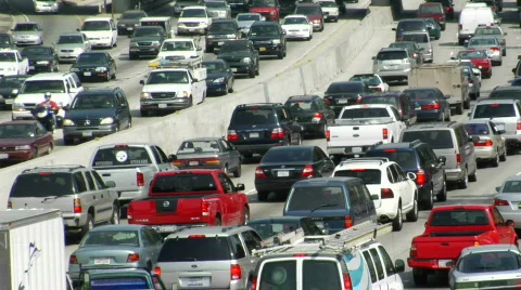 Traffic moves slowly along a busy freeway in Los Angeles. Stock Footage