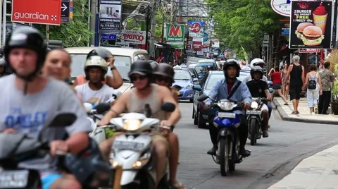 Traffic moves slowly along a busy road in Kuta. Island Bali, Indonesia Stock Footage