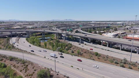 Traffic moves through the Spaghetti Bowl interchange in Utah Stock Footage 341623243