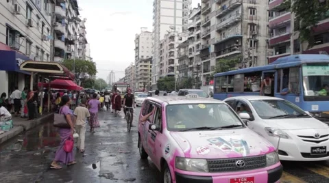 Traffic Moves Towards Camera in Yangon, Burma (Cars/People/Monks) Stock Footage 56632839