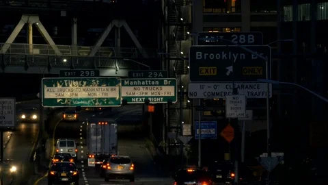Traffic moving along a freeway in New York at night Stock Footage 92525597