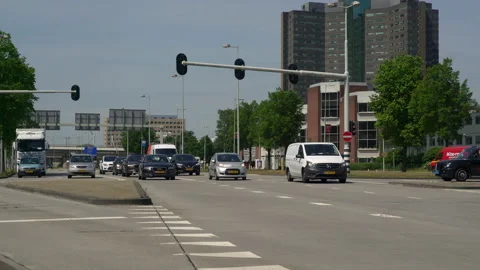 Traffic moving in between the highway A10 and the Amsterdam Sloterdijk business Stock Footage 131336785