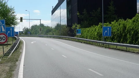 Traffic moving in between the highway A10 and the Amsterdam Sloterdijk business Stock Footage 131337063