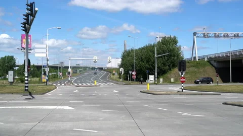 Traffic moving in between the highway A10 and the Amsterdam Sloterdijk business Stock Footage 131337068