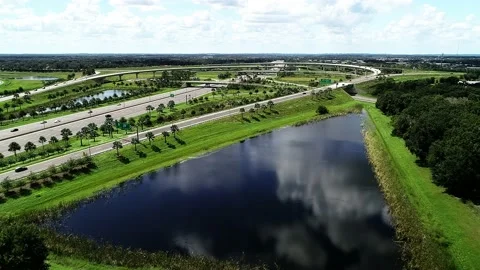 Traffic moving at the Florida's Turnpike and Route 429 Interchange in Stock Footage