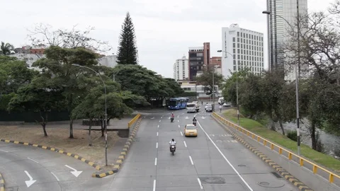 Traffic moving forward away from Cali Tower in Cali, Colombia Stock Footage 122307918