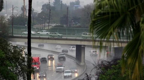Traffic moving on freeway during heavy rain Video stock 45295693