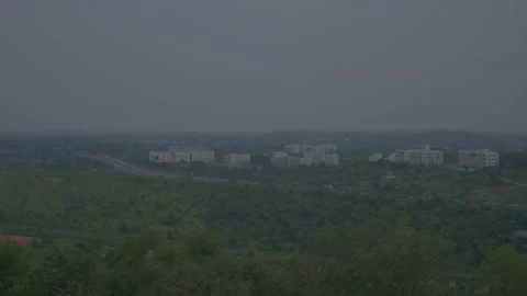 Traffic moving on the highway between the city and the forest Video stock 221114984