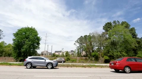 Traffic on a multi lane highway in super slow motion colorful cars Stock Footage 180131631