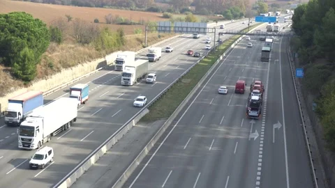 Traffic in multiple lane highway Stock Footage 142318276