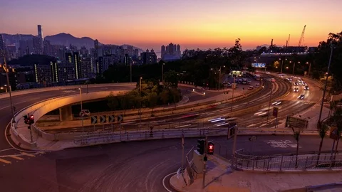 Traffic on multiple lane highway with motion blur in Hong Kong at dusk - Time la Stock Footage 84630134