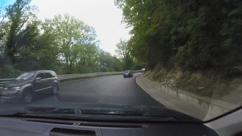 Traffic on new road without road markings. View of through wondschield of moving Stock Footage 106590932