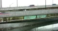 Traffic next to river. HD Footage