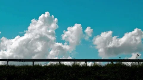 Traffic with a nice cloudy sky as the background Stock Footage 98678719