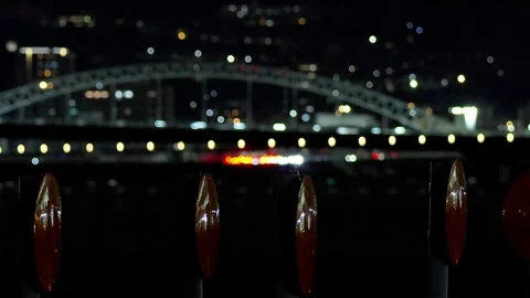 Traffic Night View Passing Arch Bridge and Orange Reflectors,4K Stock Footage 346080096
