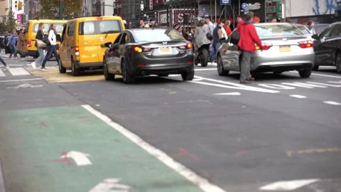 Traffic in NYC Intersection. New York road traffic and pedestrians Stock Footage 132462592