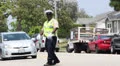 Traffic Officer directs traffic in Los Angeles HD Footage