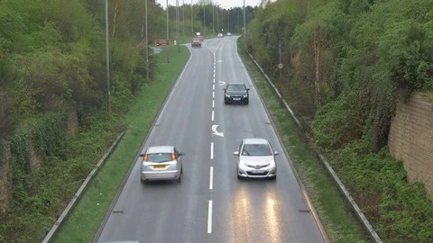 Traffic Pasing on a Damp 50mph Road Stock Footage 89001103