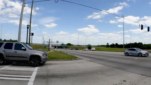 Traffic pass at an intersection distant bridge cars and smoke Hwy 520 Stock Footage 185617622