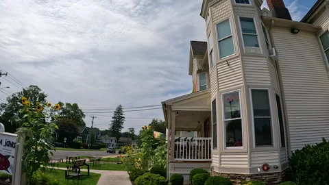 Traffic passes Molten Java Coffee-house in Bethel Connecticut 2023 Stock Footage 249040481