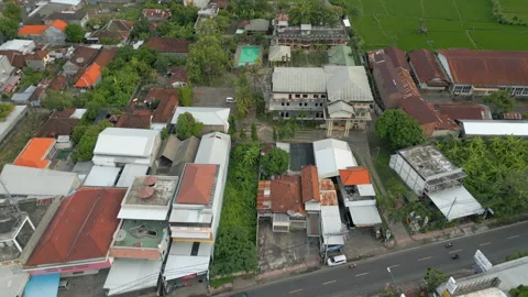 Traffic Passes Through Main Street Of Buleleng North Bali Indonesia Drone Track Video stock 345007854