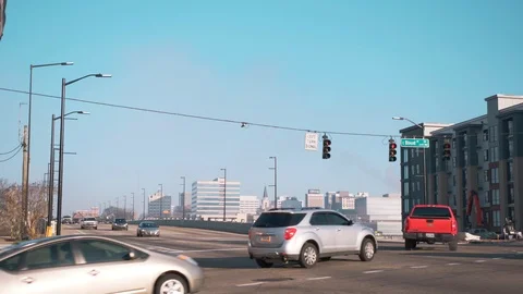 Traffic passes through urban intersection Stock Footage 102332861