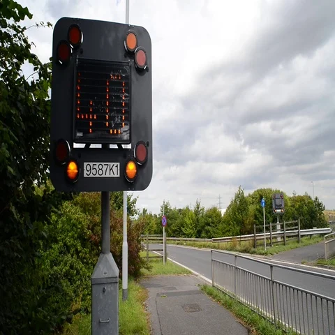 Traffic passing 40mph flashing warning sign on A1/M motorway uk Stock Footage 69122804