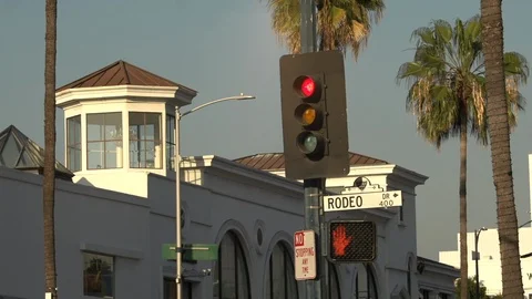 Traffic passing beneath the Rodeo Drive sign, Beverly Hills California Stock Footage 124176900