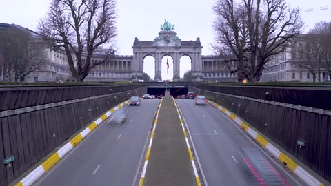 Traffic passing the Cinquantenaire arch in Brussels, Belgium during a winter's Stock Footage 142722238