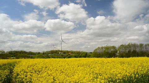 Traffic passing electricity generating windmills by m18 motorway sheffield uk Stock Footage 49989996