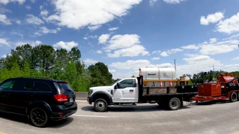 Traffic passing by on a highway bridge blue sky with clouds Stock Footage 185453967