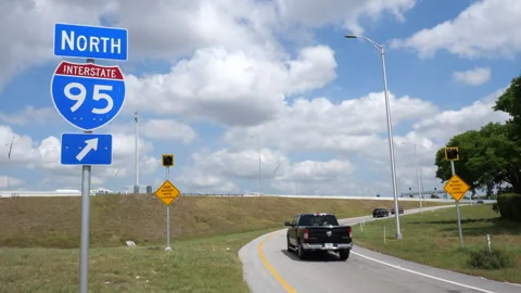 Traffic Passing I-95 North Sign On-Ramp Stock Footage 309714947