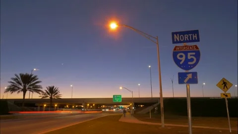 Traffic Passing I-95 Sign Twilight Stock Footage 200844643