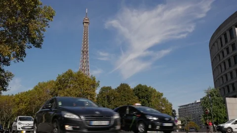 Traffic passing infront of the Eiffel Tower along the Quai Branly Stock Footage 97483590