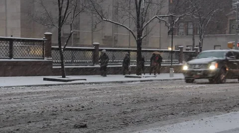 Traffic passing Morgan Library in Heavy Snow or Blizzard NYC Stock Footage 53881695