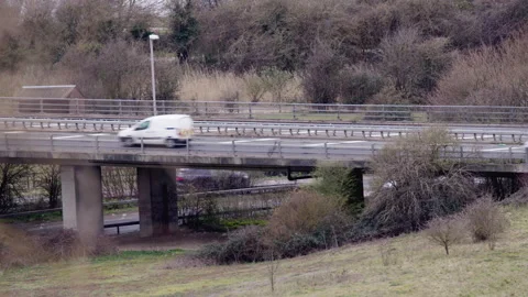 Traffic Passing Over and Under Bridge Stock Footage 151712459