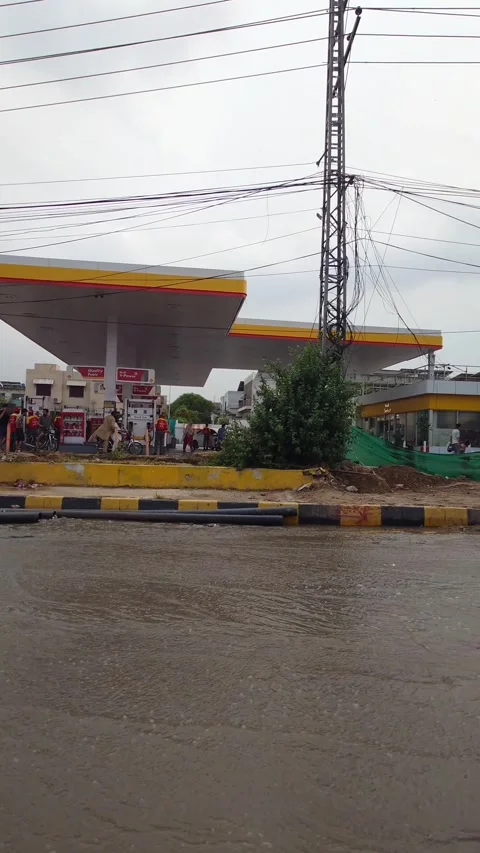 Traffic Passing By Shell Gas Station In Raining, Rawalpindi Pakistan 12 Jul 2026 Stock Footage 339456600