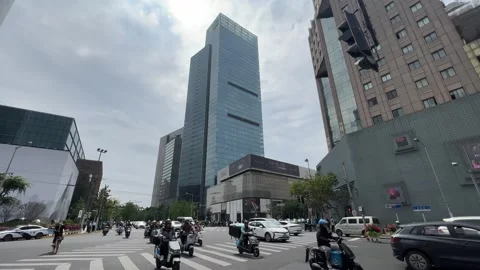 Traffic passing through the Jing An Temple Residential District, Shanghai Stock Footage 252971820
