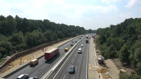 Traffic passing through roadworks on the M3 in Hampshire Stock Footage 66303333