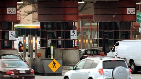 Traffic passing through a toll booth in the city. Video stock 88342367