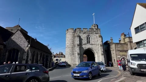 Traffic passing through the Westgate Towers in Canterbury, Kent Stock Footage 304865353